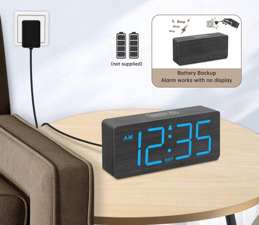 A wooden large screen displaying an alarm clock figurine