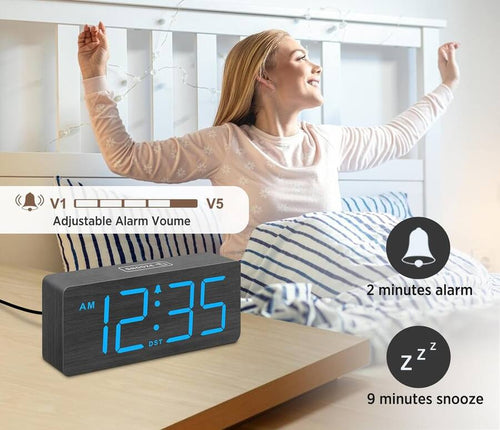 A wooden large screen displaying an alarm clock figurine